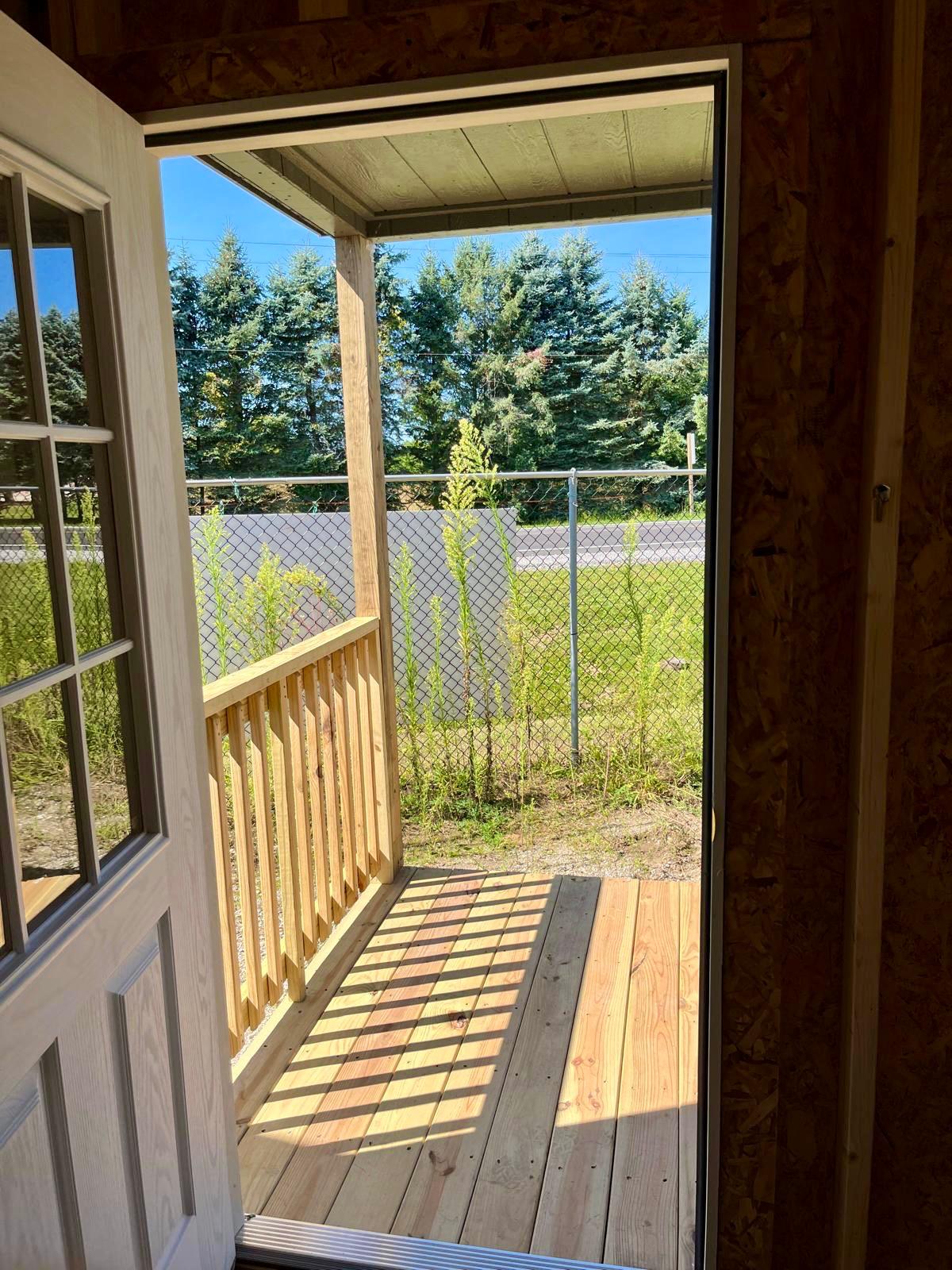 backyard cabin with porch entryway