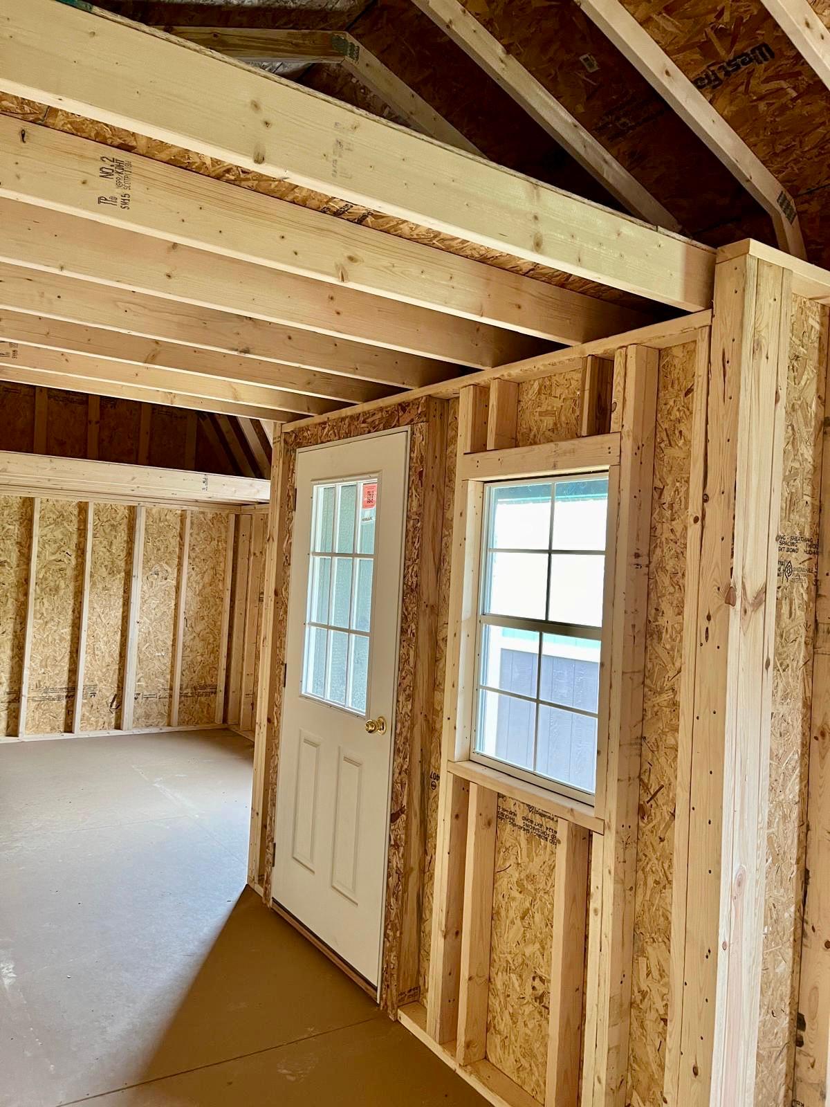 portable lofted barn bunkie cabin with porch inside
