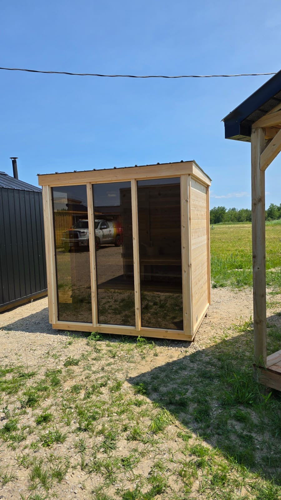 white cedar sauna glass front rural
