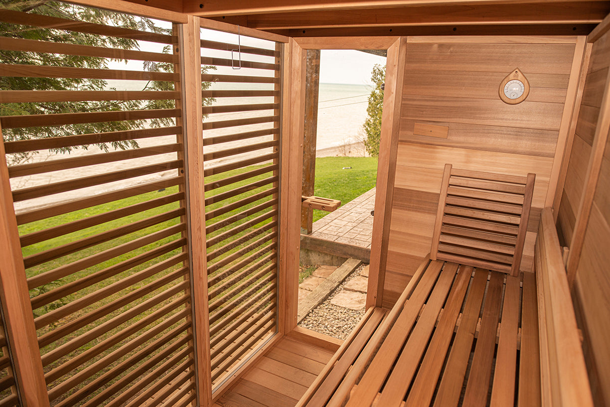 Wooden sauna with a view of a grassy area and trees