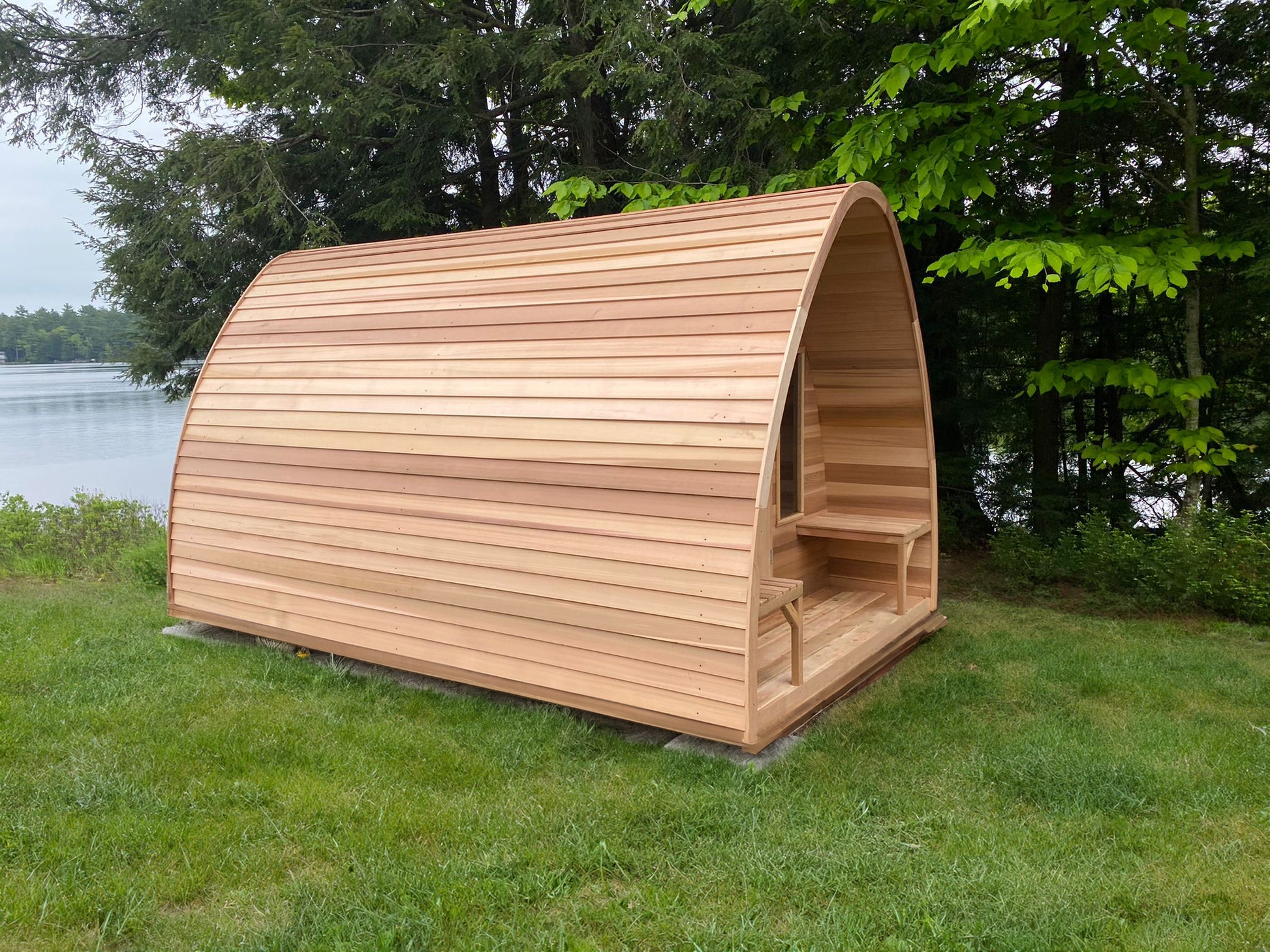 red cedar pod sauna with porch at lake 