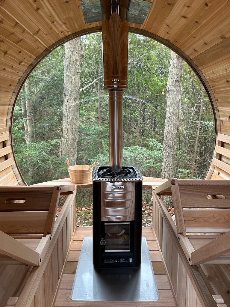 red cedar barrel sauna in woods panoramic 