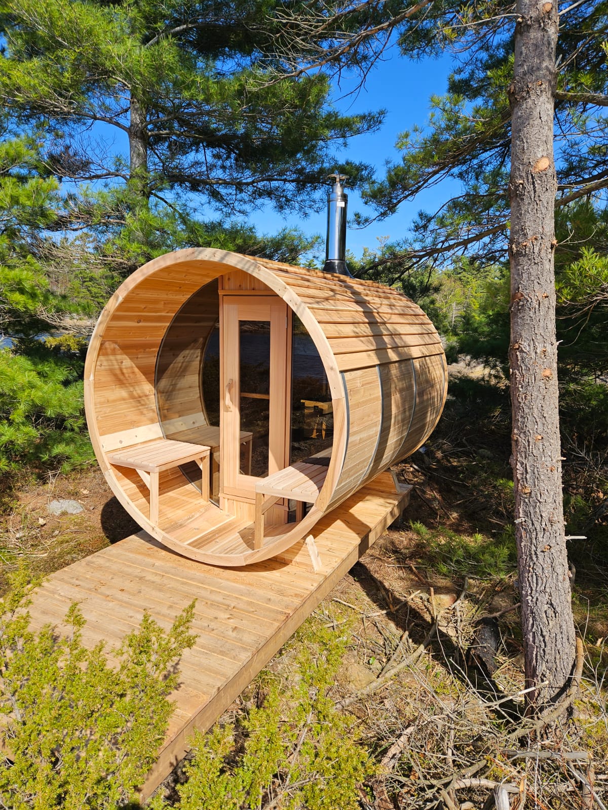 red cedar barrel sauna in woods
