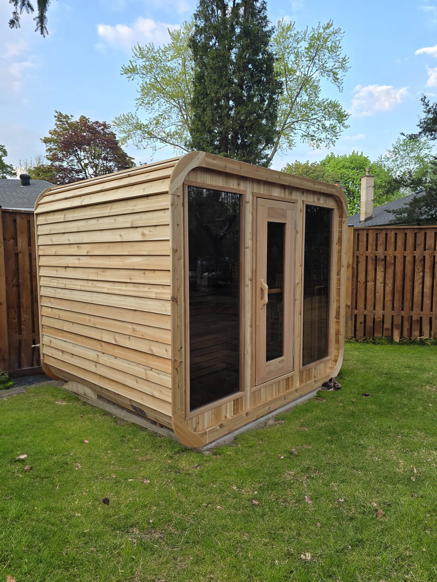 red cedar luna sauna in backyard