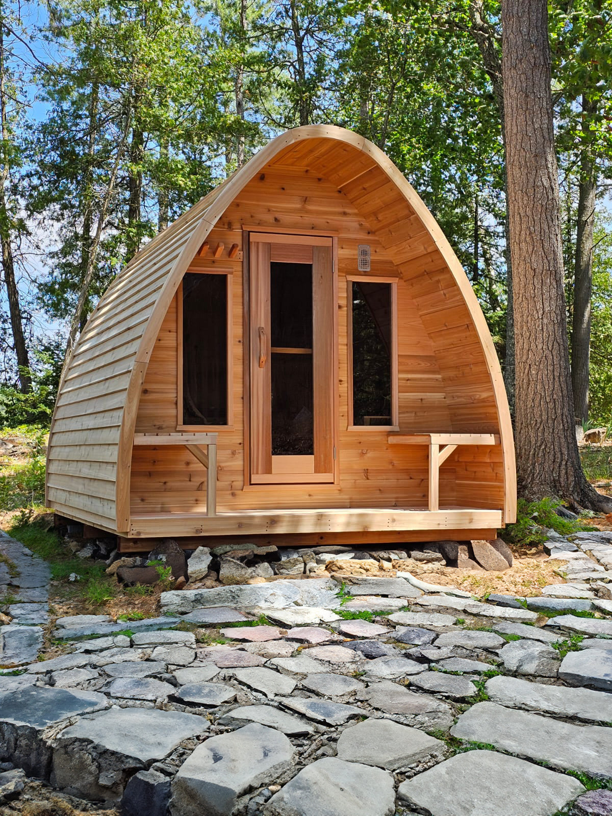 red cedar pod sauna in woods 