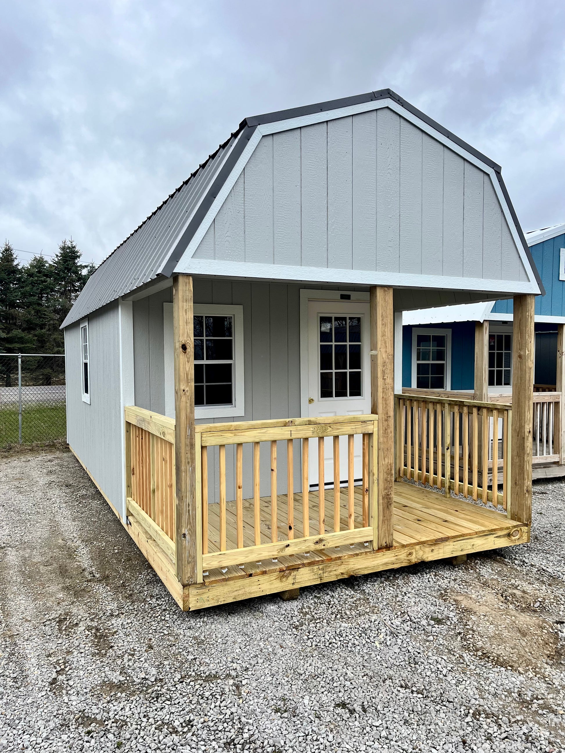 portable lofted barn cabin bunkie with porch gray
