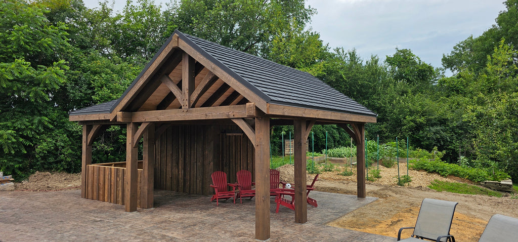 Wooden pavilion with a roof in a garden setting