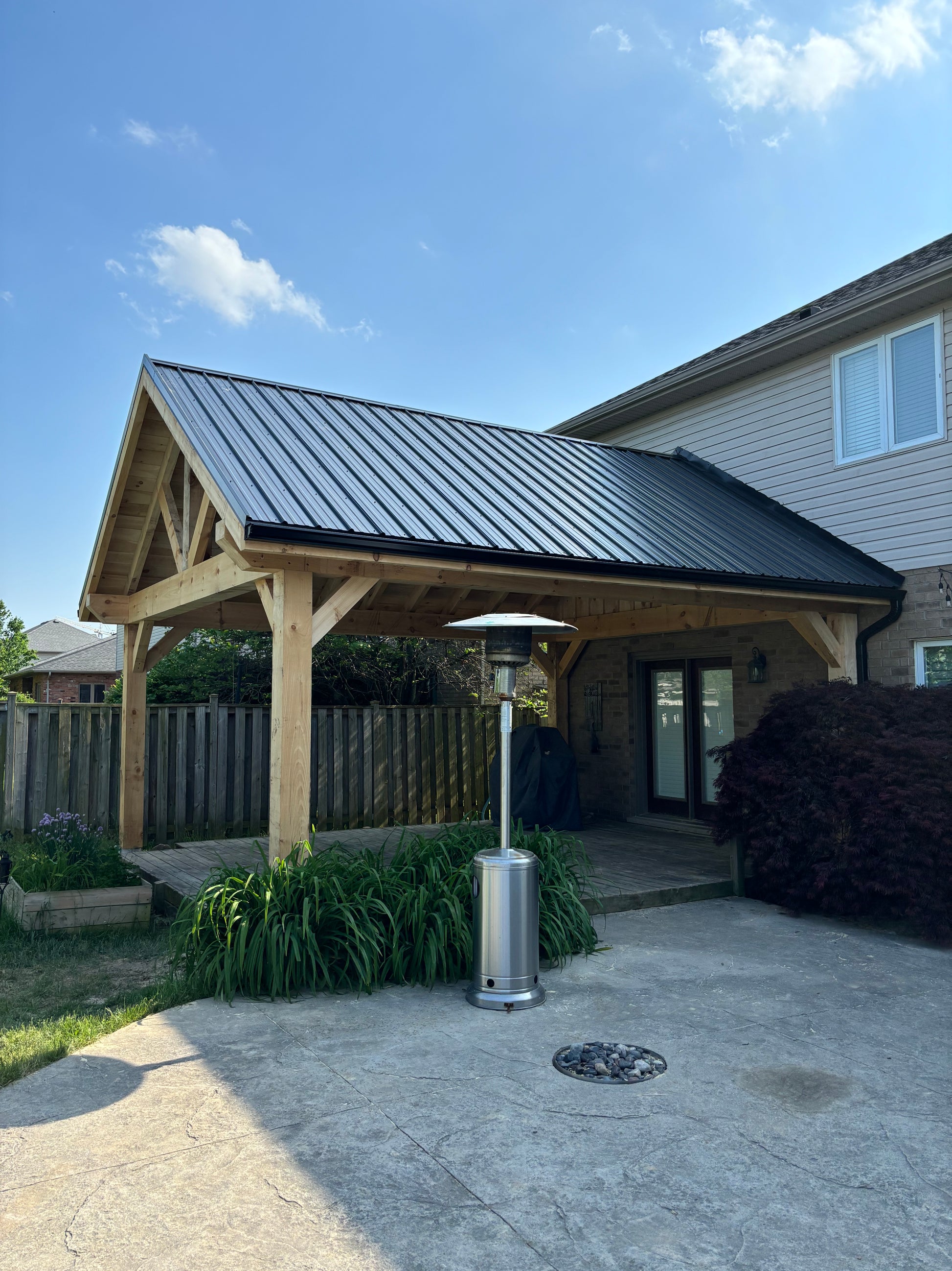 A-frame timber pavilion over back porch