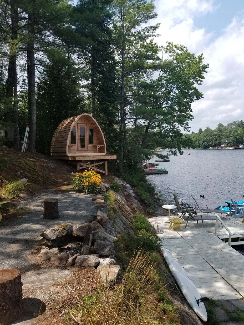 red cedar pod sauna at lake