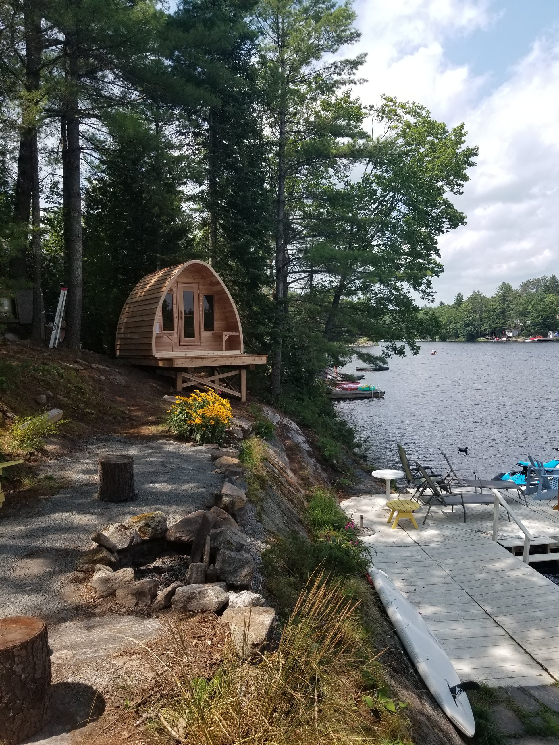 red cedar pod sauna at lake