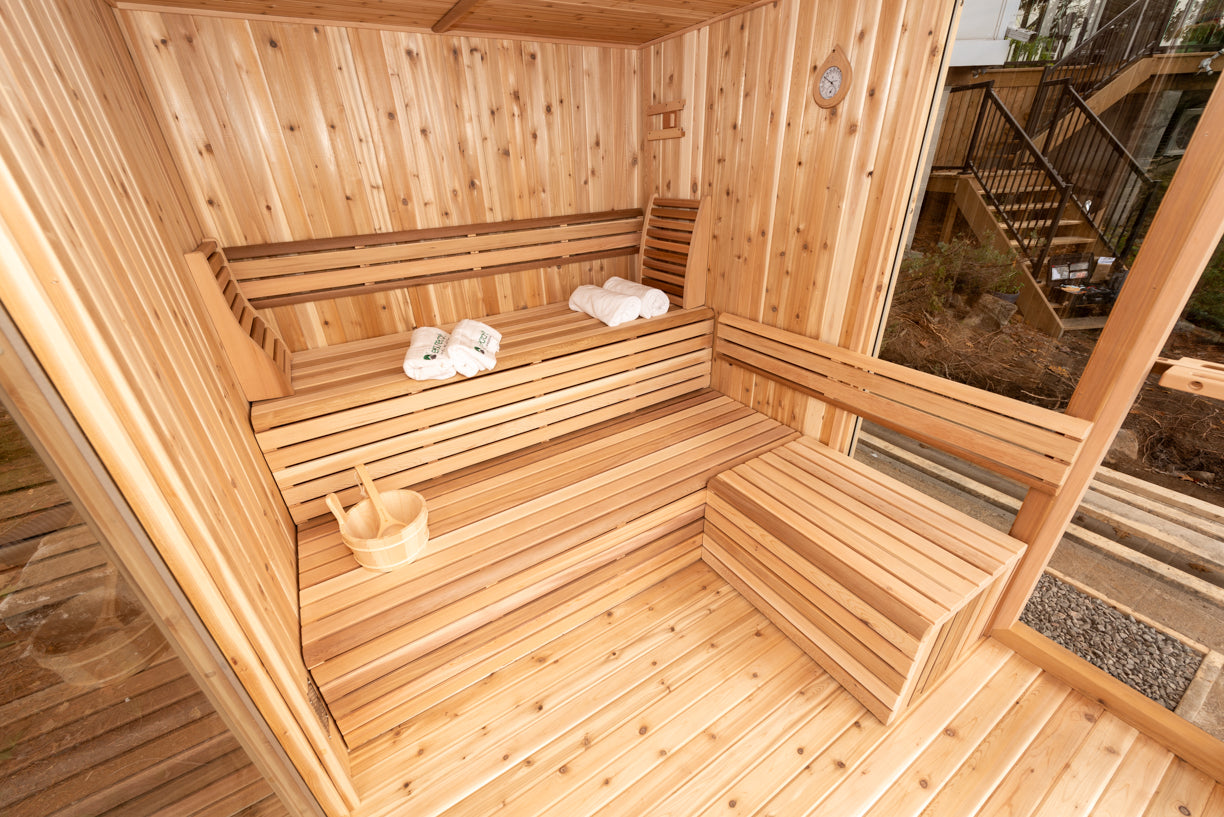 red cedar Wooden sauna with benches and towels inside