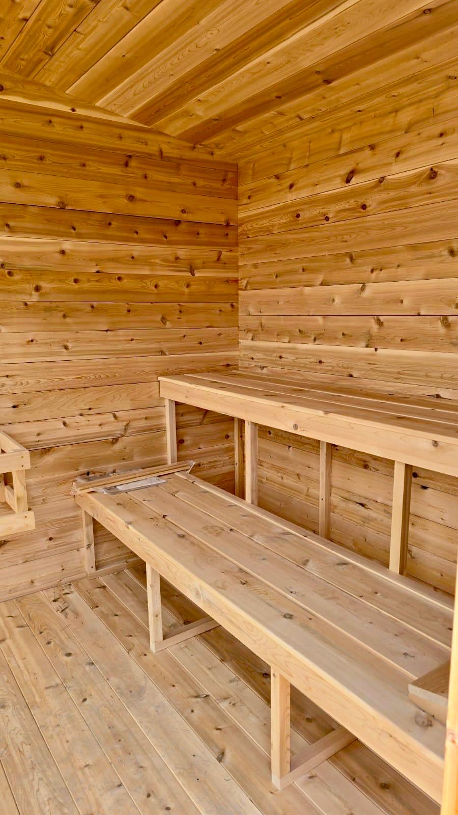 Wooden interior of a sauna with benches.