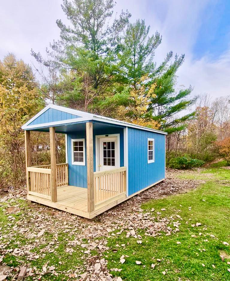 backyard cabin with porch blue