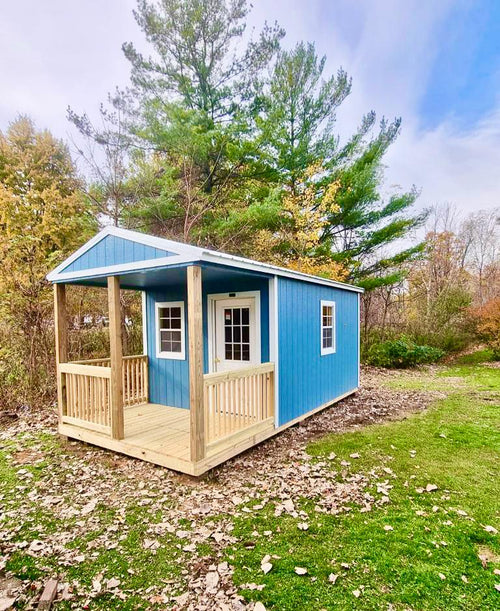 backyard cabin with porch blue